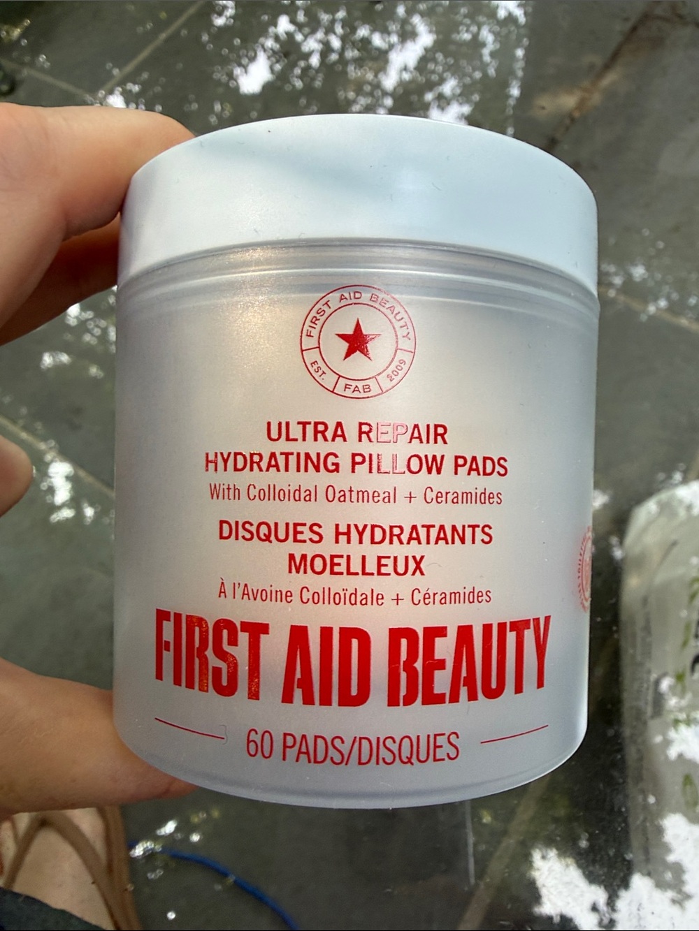 First Aid Beauty White Jar with Red Logo Hydrating Pillow Pads